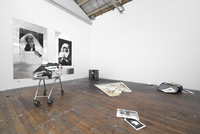 Aluminium screen prints amongst an installation of past work.