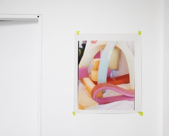 close up photograph of a photographic print depicting a colourful sculpture