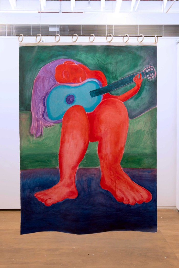 a painting of a red figure with purple hair sitting on a green bed playing a red guitar hangs from ceramic rings and a pole like a curtain
